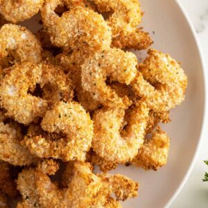 air fryer popcorn shrimp piled on a plate