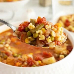 alphabet soup piled on a spoon