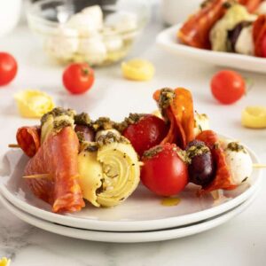 Antipasto skewers on a white plate