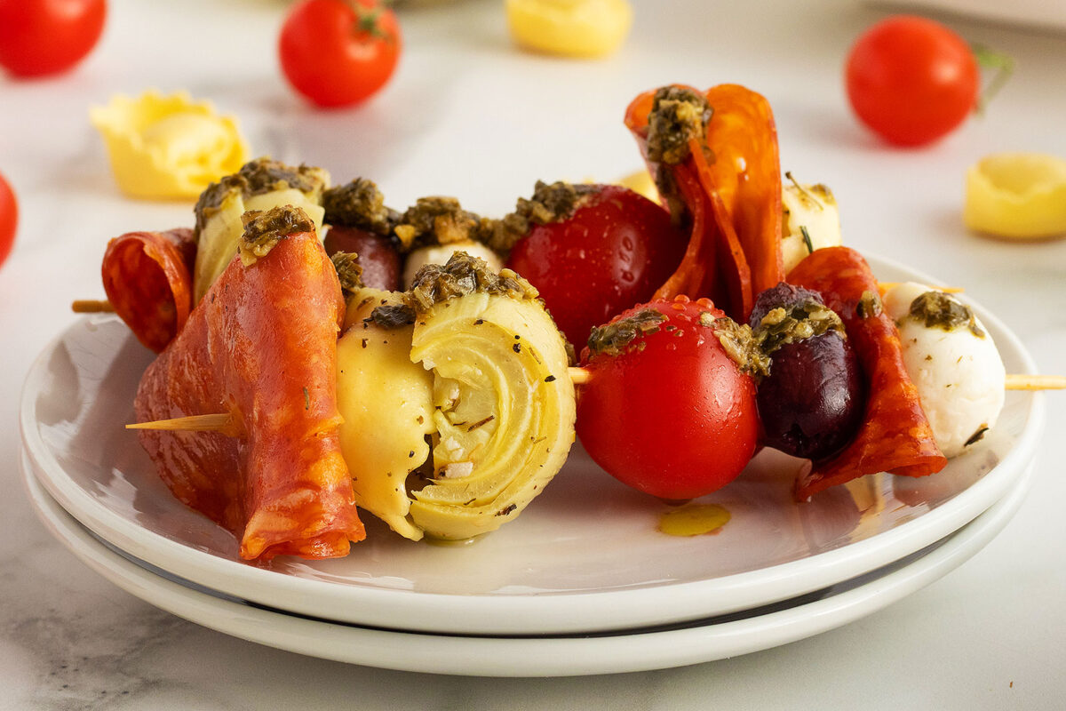 antipasto skewers on a white plate