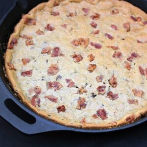 close up giant Chocolate Chip Cookie with bacon in a large Skillet