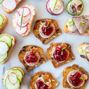 Assorted canapés garnish with chopped chives