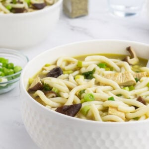 Chicken Mushroom Udon Noodle Soup in a bowl close up