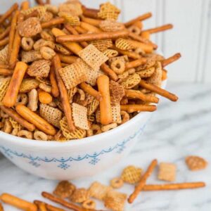 close up Nuts and Bolts in a white bowl ready to be enjoy!