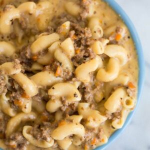 Macaroni Cheeseburger Soup in a blue bowl