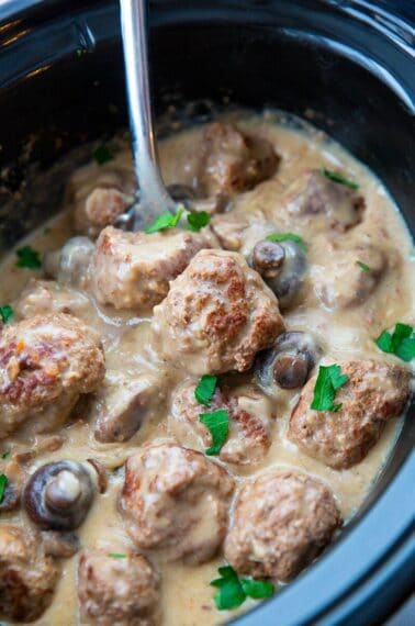 removing the meatballs from the crock pot