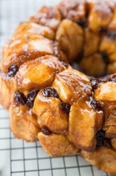 Close up of homemade monkey bread with raisins and brown sugar coating