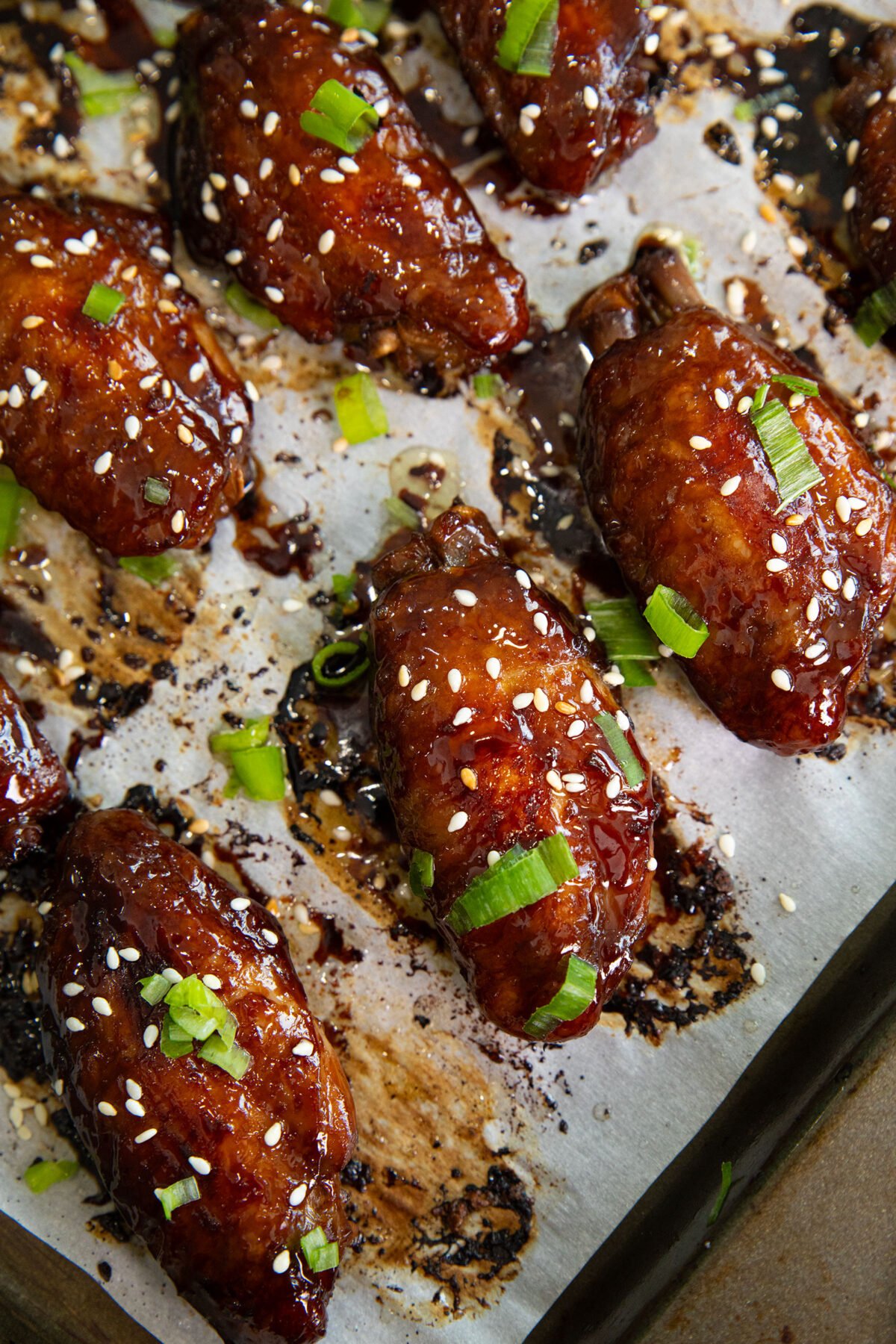 stick honey sesame chicken wings on a baking sheet