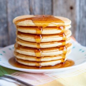 adding syrup on a stack of Bisquick® Pancakes