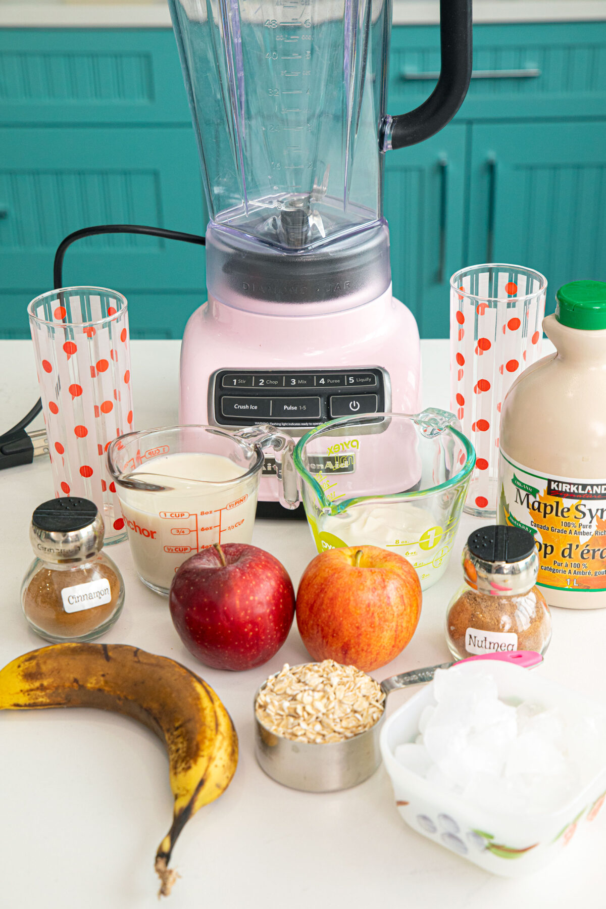 ingredients laid out on a white countertop in front of a pink mixer.