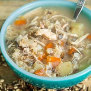 no dairy Chicken & Wild Rice Soup in a jade blue soup bowl