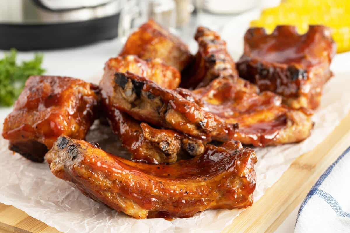 instant pot ribs sliced on a piece opf parchment