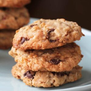 close up stack of Oatmeal Chocolate Chip Cookies in a white plate