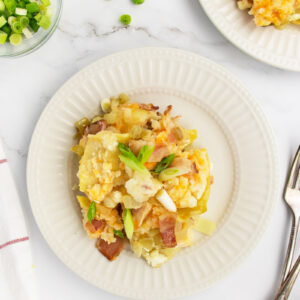 pierogi casserole on white plate with fork