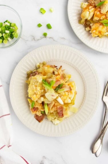 pierogi casserole on white plate with fork