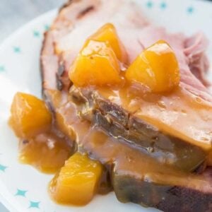 Close up of Rum Ham with pineapple tidbits in a white plate