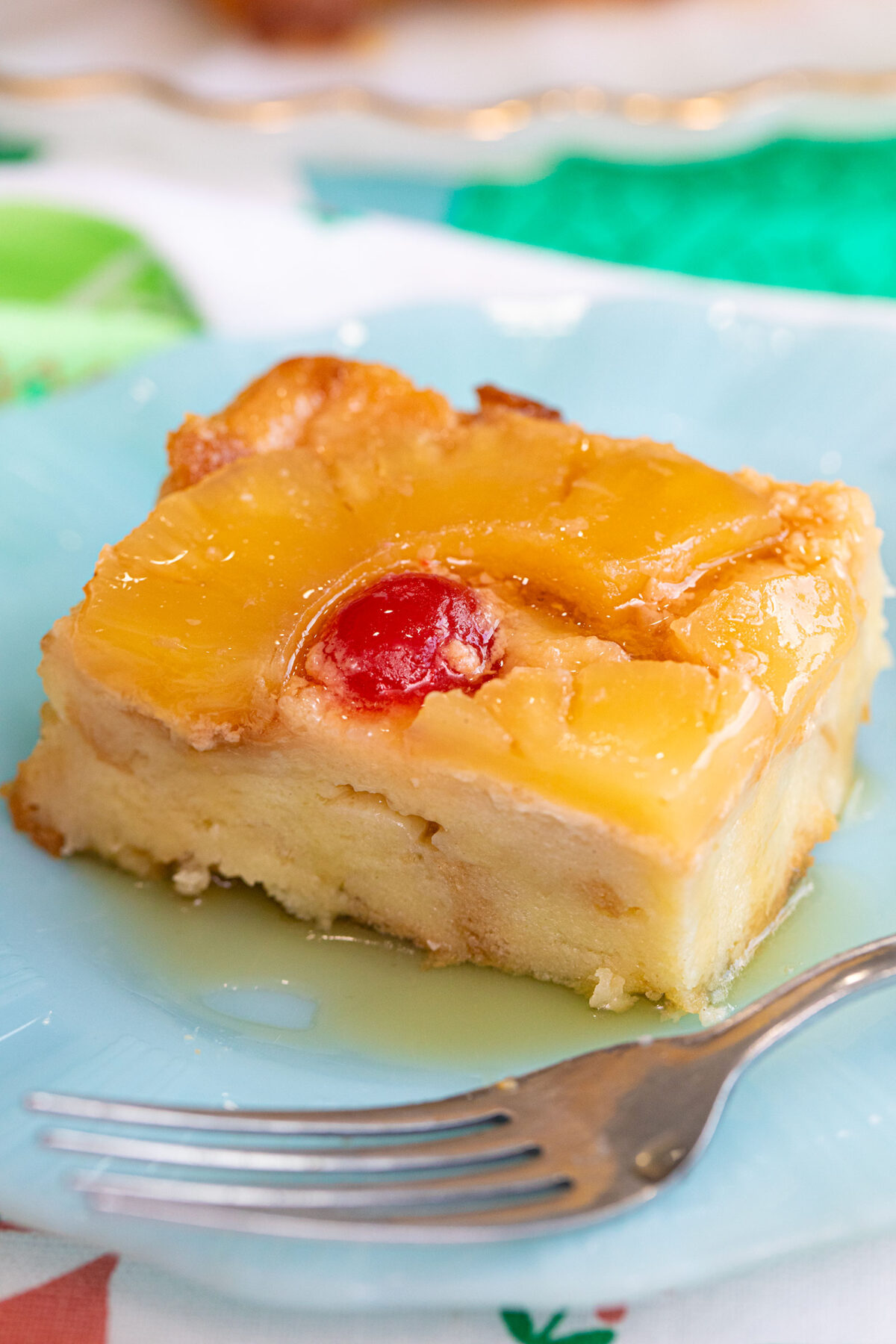 a slice of pineapple bread pudding on a blue plate