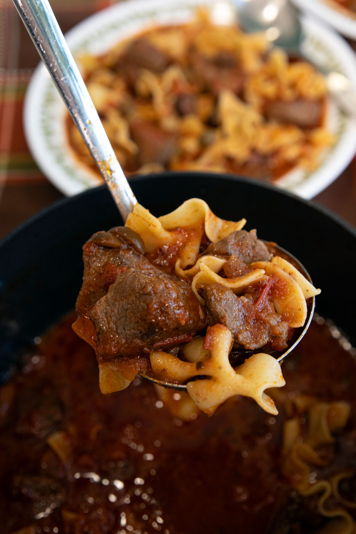 a ladle full of puttanesca soup