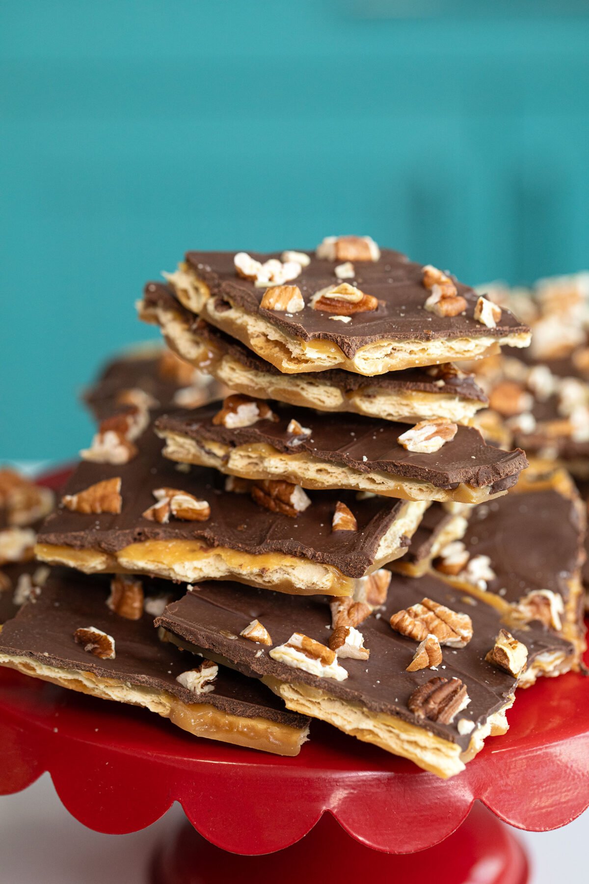 a large stack of saltine toffee squares