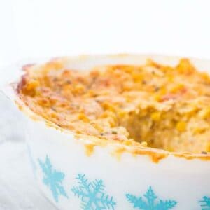 Scalloped Corn Casserole in a Pyrex Turquoise Snowflake Casserole dish