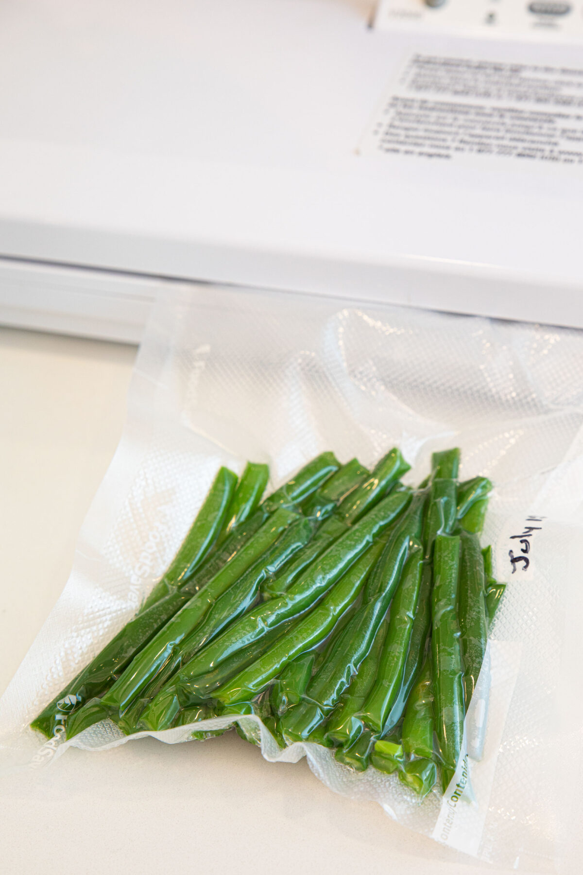 blanched green beans in a freezer bag 