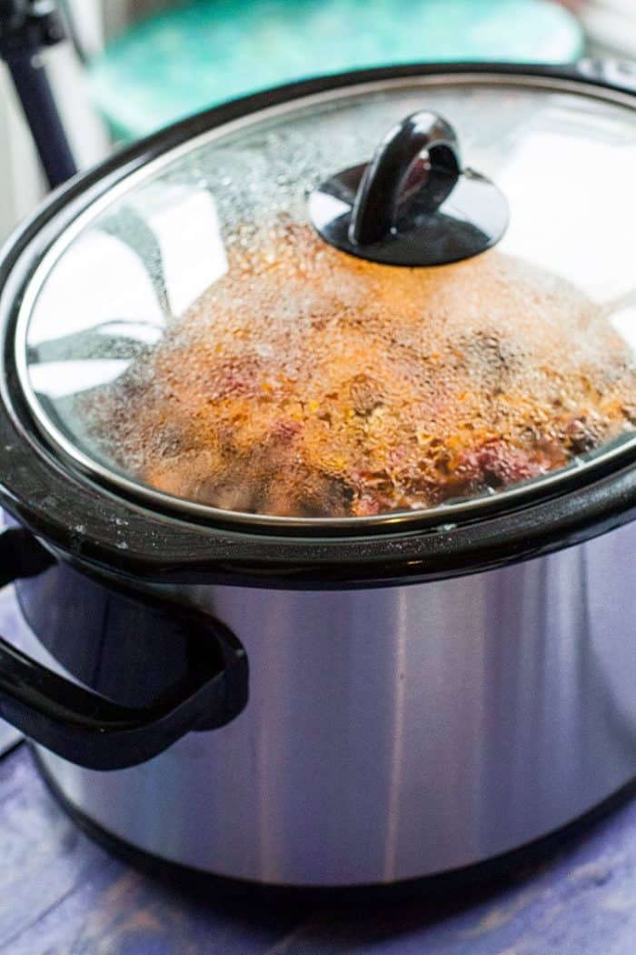 cooking the rice on a crockpot with lid on top