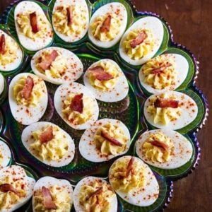 close up Bacon Deviled Eggs in a retro carnival glass deviled egg plate