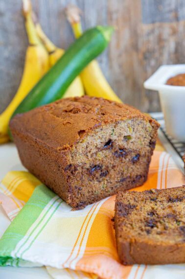 Sliced Zucchini Banana Bread, Bananas and Zucchini on background